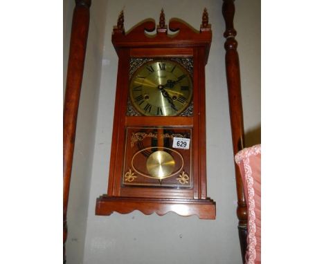 A mid 20th century spring wind wall clock in working order. COLLECT ONLY.