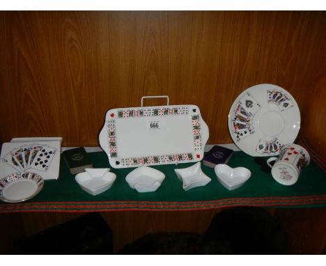A mixed lot of playing card decorated ceramics etc.,