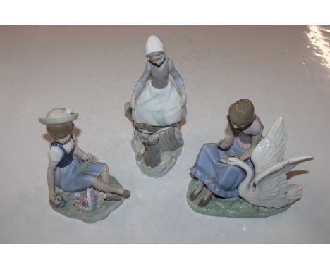 A Nao figure, young girl with swan and two Lladro figurines 