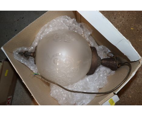 A vintage hanging light fitting of globular form 