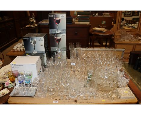 A large quantity of various table glassware to include decanters and stoppers, boxed glassware, candlestick etc. 