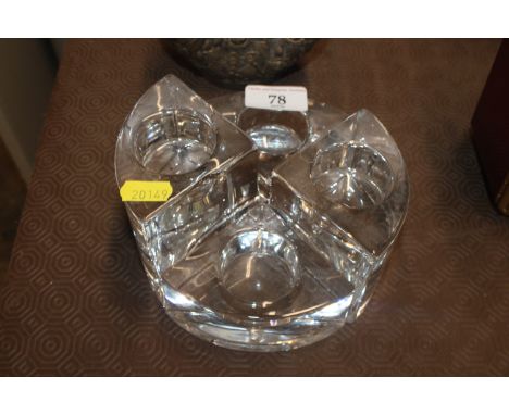 A Orrefors four piece candle holder 
