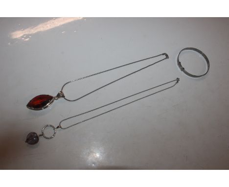 Twp Sterling silver pendant necklaces; and a Sterling silver bangle 