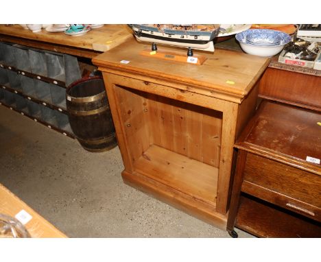 A pine open fronted bookcase with one adjustable shelf 