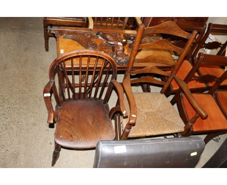 A mahogany and rush seated ladder back carver chair and an elm seated stick back chair 