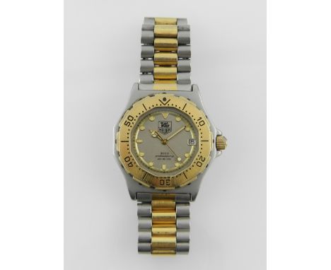 Tag Heuer, Switzerland. A gentleman's bi-colour stainless steel wristwatch, the tonneau case having a uni-directional time el