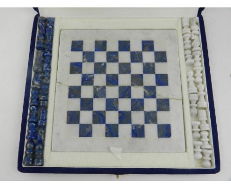 A lapiz lazuli and white marble chess set manufactired by Morita Gil. 