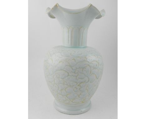 A Chinese pale ceramic vase, decorated with foliate design.
