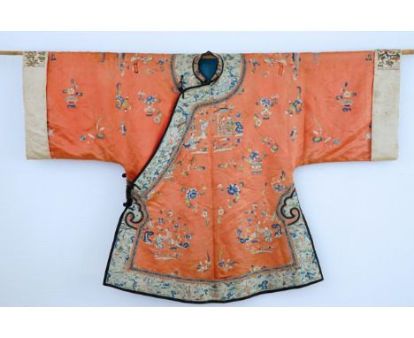A Chinese silk embroidered child's robe, 19th C. Dim.: 146 x 98 cm  The front slightly faded from sunlight exposure, the back