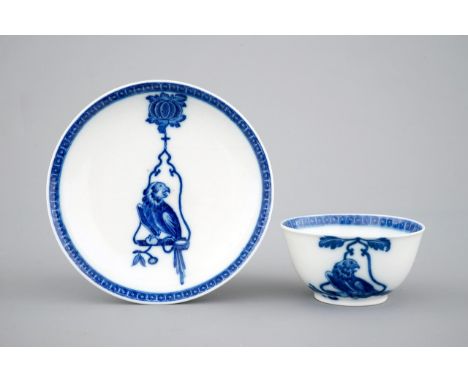 A blue and white Chinese porcelain cup and saucer: "The parrot on the perch", Qianlong, ca. 1740 The design probably inspired