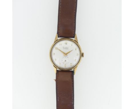 A vintage Audax 9ct gold gentleman's Wristwatch, with Swiss movement, the circular dial with gilt Arabic numerals and seconds