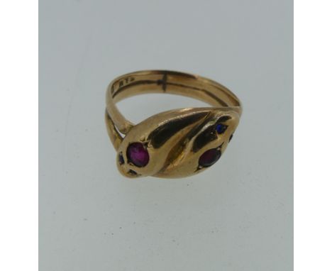 An antique 9ct rose gold double snakes head Ring, the heads each set ruby and with two sapphire eyes, Size Q, 4.9g. 