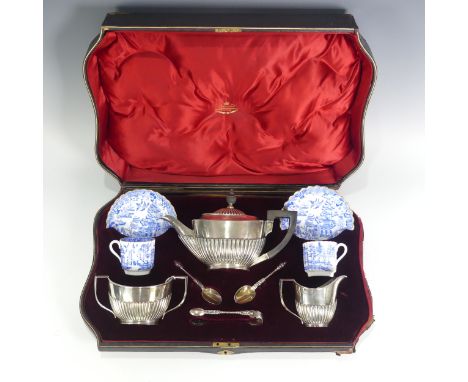 A cased Victorian silver three piece tete-a-tete Tea Set,&nbsp;by&nbsp;Goldsmiths &amp; Silversmiths Co., hallmarked Sheffiel