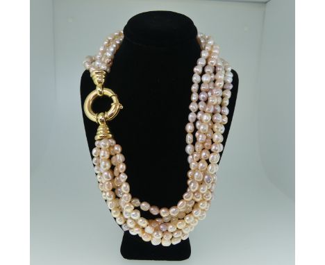 A multistrand freshwater pearl Necklace, formed of six rows of pearls approx. 6-8mm long, with pink and purple hues, on an 18