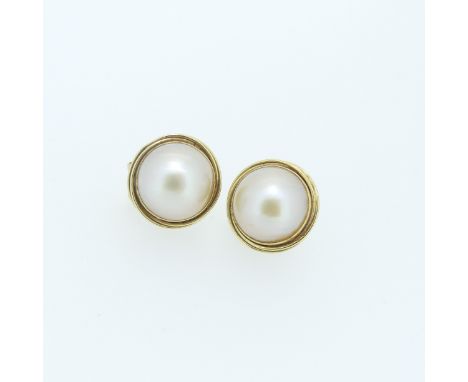 A pair of Mabé Pearl Earrings,&nbsp;mounted in&nbsp; 14ct gold,&nbsp;2cm overall diameter, pillar and clip fitting, total wei