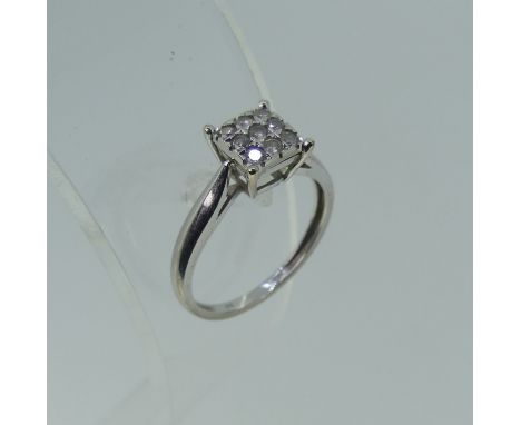 A 9ct white gold and diamond cluster Ring,&nbsp;the square front set with three rows of three small brilliant cut stones, tot