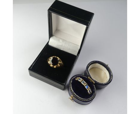 A 9ct yellow gold Ring, set with a circular facetted garnet, 10mm diameter, Size U, together with a faux moonstone paste set 