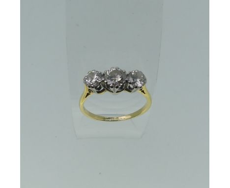 A three stone diamond Ring, the centre circular stone approx 0.63ct, with a smaller stone one either side, each approx. 0.42c