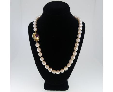 A single row of baroque cultured Pearls,&nbsp;formed of 45 pearls, approx 8-9mm long, the 18ct gold snap with collet set cabo