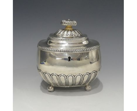 A George III silver Tea Caddy,&nbsp;by&nbsp;William Bennett, hallmarked London, 1812, of rounded rectangular form with demi f