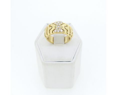 An 18ct gold and diamond Dress Ring, the centre pavé set with eleven small diamonds,Size L½, 9.8g. 