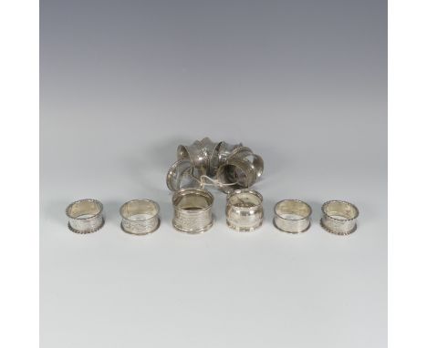 An Edwardian silver Napkin Ring, hallmarked Birmingham, 1908, together with five other silver napkin rings, 3.2ozt, and a set