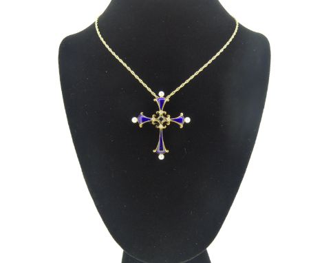 A 'Midnight Sapphire Cross' from The House of Igor Carl Faberge, for Franklin Mint, the blue enamel cross set with four cultu