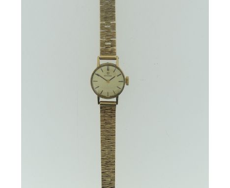 A 9ct yellow gold Omega lady's Wristwatch, with circular silvered dial, gold baton markers and hands, with a Cal.485 manual w