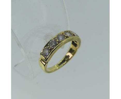A diamond half hoop Eternity Ring, the seven brilliant cut stones each approx. 0.075ct, claw set within a channel in 18ct yel