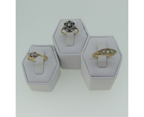 A small graduated five stone diamond Ring, in boat shaped mount with scroll gallery, all in 9ct gold, Size N½, together with 