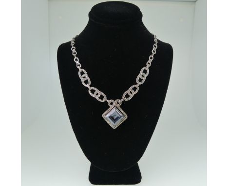 A vintage German silver, blue paste and marcasite Necklace and Earring Suite, the necklace 42cm long, corresponding screw fit