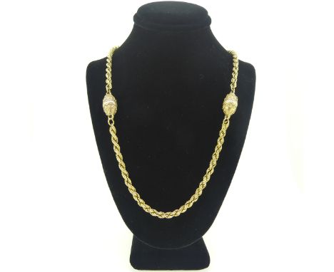 A 9ct gold ropetwist Necklace, with two barrel shaped beads, marked only on bolt ring clasp, tested, 52cm long, 30.6g. 