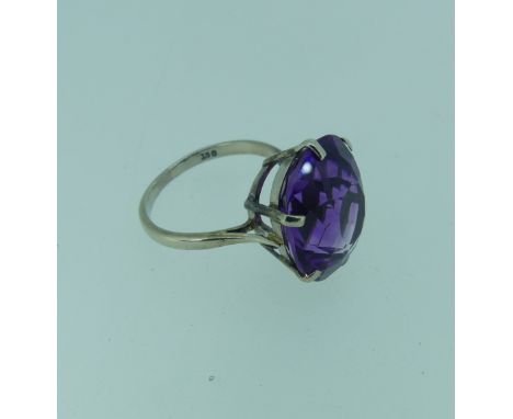 An amethyst Dress Ring,&nbsp;the oval facetted stone 15.75x13.9mm, claw set in 9ct white gold, Size N, 4.7g. 