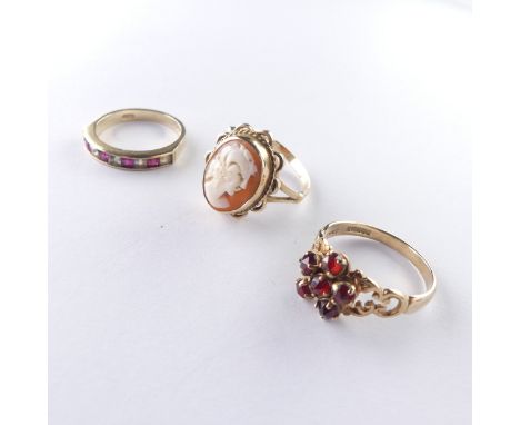 A 9ct gold shell cameo Ring, Size O, together with a garnet cluster ring, Size P and a red and white paste ring, Size N, both