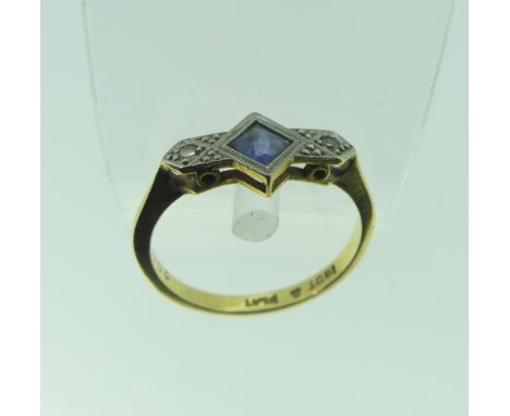An Art Deco sapphire and diamond Ring, the central square sapphire, 4.7mm wide, with a diamond point on either side, all mill