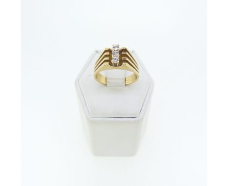 A yellow gold Ring, with split reeded shoulders, the front vertically set three white pastes, tests as 14ct gold, Size M, 6.3