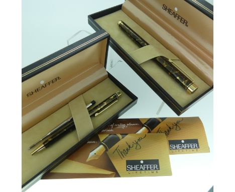 Sheaffer white dot fountain pen, in brown marbled gold, and a matching ballpoint pen, both with presentation cases with instr