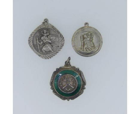 Two silver St. Christopher Pendants, together with a quantity of silver fobs, a damaged ingot pendant, thimble, locket etc., 