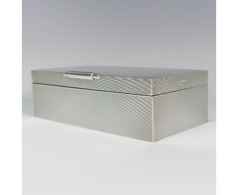 An Elizabeth II silver Cigarette Box, by&nbsp;W H Manton Ltd., hallmarked Birmingham 1960, of rectangular form with engine tu