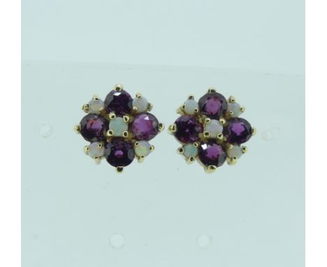 A pair of ruby and opal cluster Earrings, in the form of a flowerhead, all mounted in unmarked yellow gold, tested as 9ct, 12