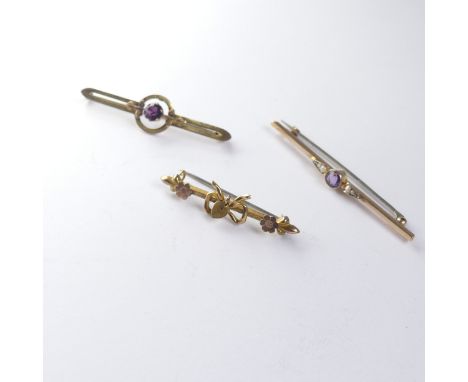 A 9ct yellow gold Bar Brooch, the centre set amethyst and seed pearl, 6cm long, together with a 9ct gold amethyst bar brooch 