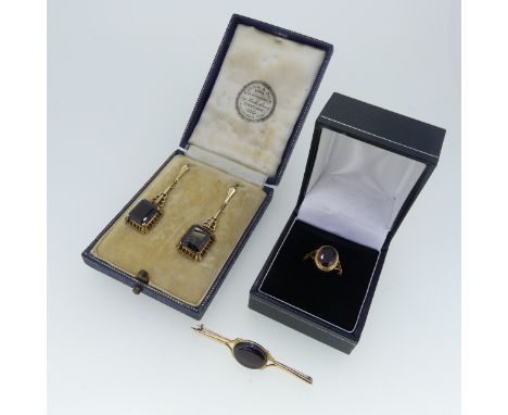 A pair of 9ct gold mounted garnet Earrings, together with a 9ct gold bar brooch, the centre with oval garnet, and a facetted 