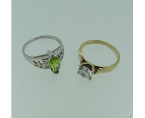 A 9ct white gold Ring, set with a facetted navette shaped peridot, Size N, together with a cubic zirconia single stone ring m