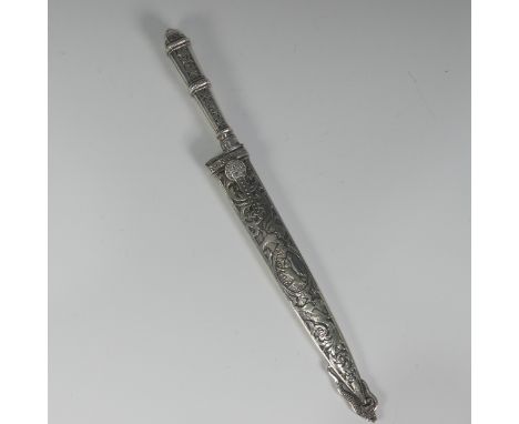 A silver South American Gaucho Cowboy Knife and Sheath, maker's mark A E &amp; Co "Marca Registrada", with steel blade, silve