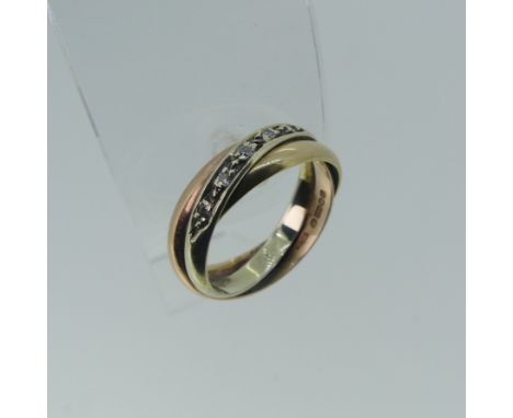 A 9ct tri-colour gold Ring,&nbsp;the twist front set with five small diamond points, Size N, 4.4g. 