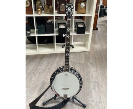 A Countryman five string banjo with fitted TKL case 