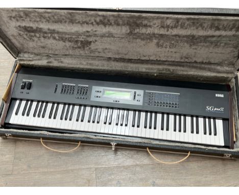 A Korg SG Pro X keyboard, with flight case, pedal and accessories
