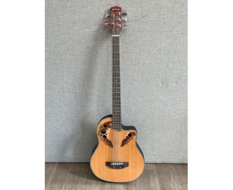 A Gear4Music Ovation style electro acoustic guitar with pierced leaf design 