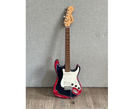 A Fender Squire Stratocaster Affinity range electric guitar, distressed red and blue body