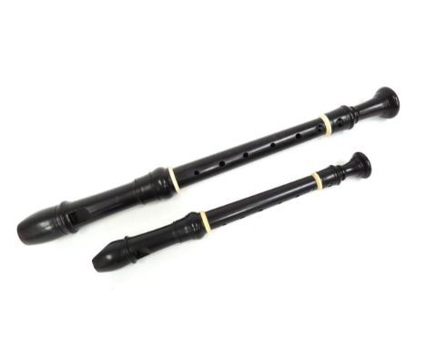 A Moeck Baroque descant recorder in black wood and a Moeck Baroque treble recorder in black wood, both with ivorine fittings 